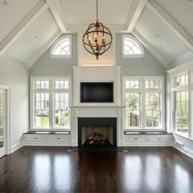 This family room adjacent to the kitchen is surrounded by Andersen E-Series Windows. All of the moulding profiles used throughout are from our in-stock collection, including poplar from our Classical Collection and true tongue & groove primed pine beadboard on the vaulted ceiling.